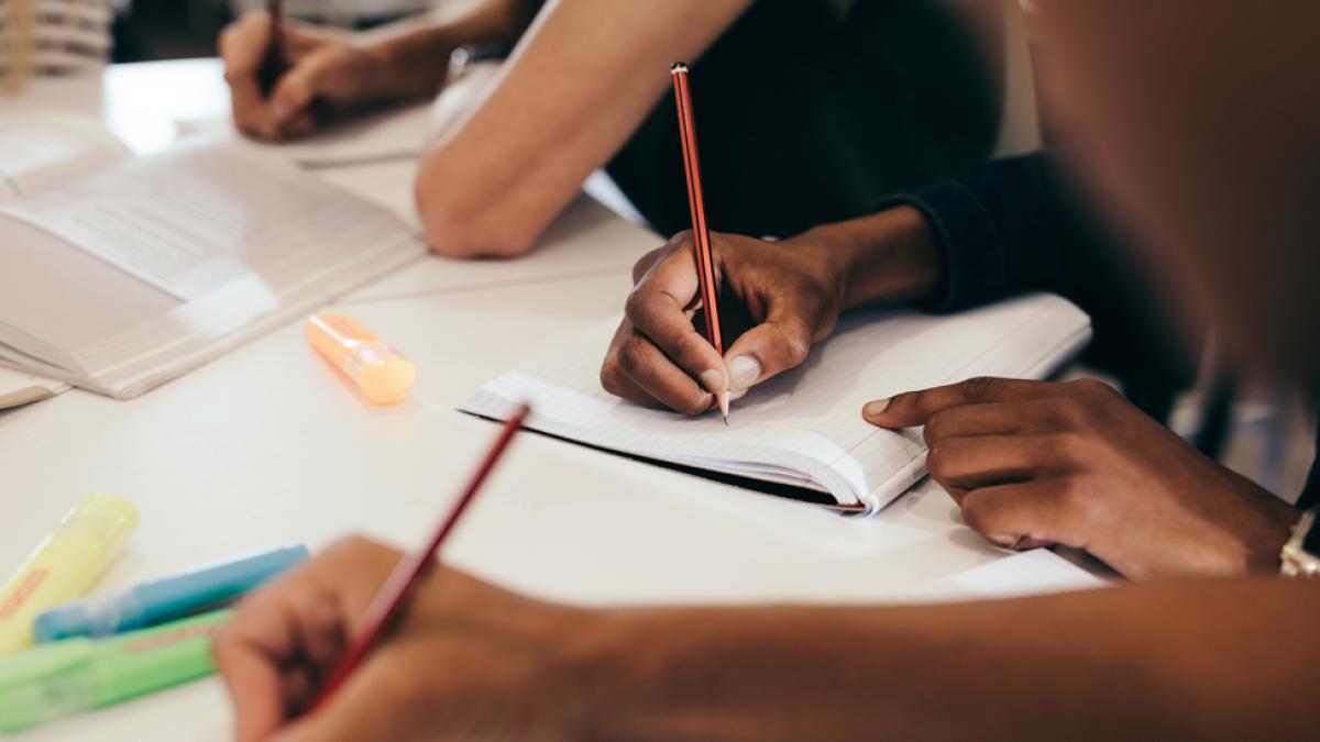 Students writing papers for class.