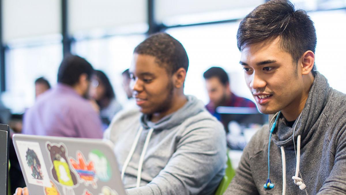 Students studying in front of their computers.