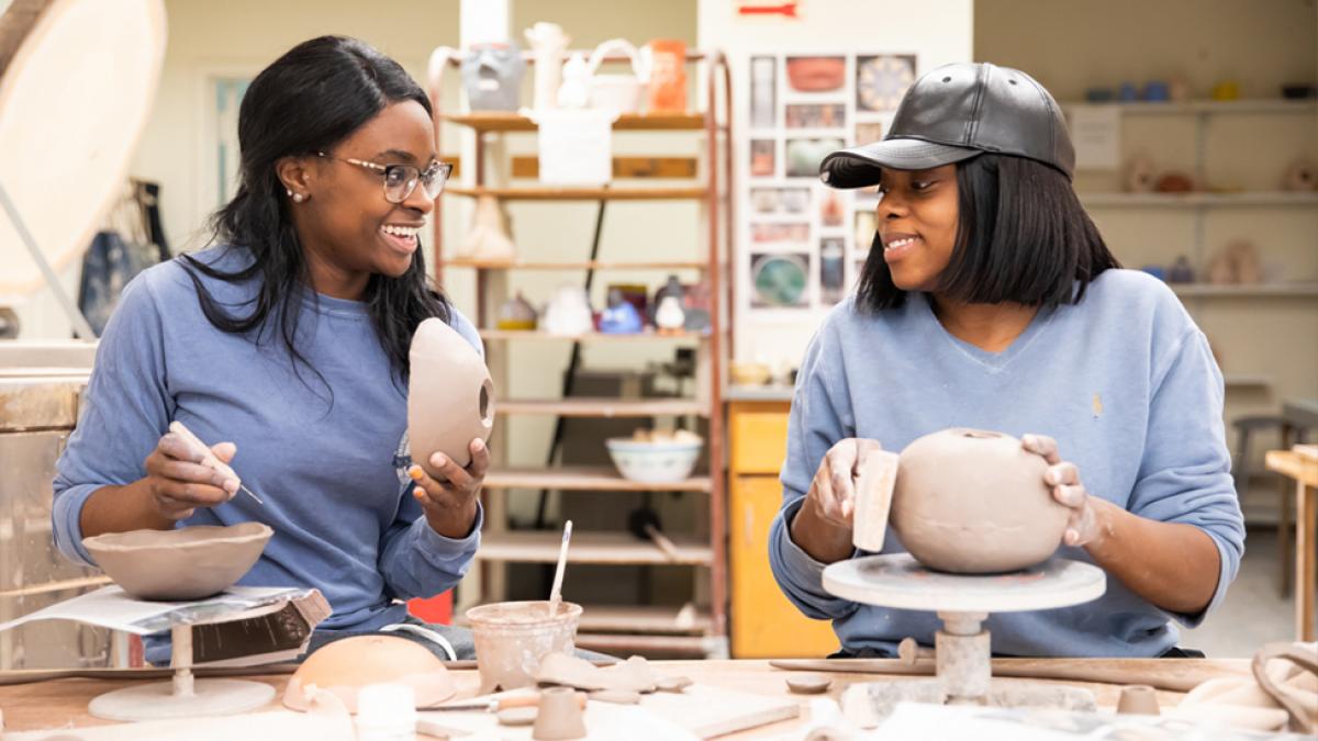 Students doing pottery.