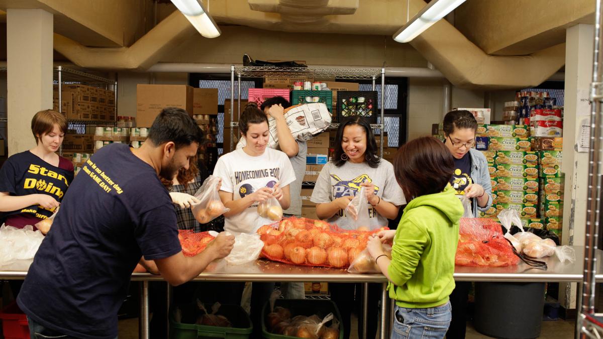 Pace students volunteering at a food pantry.