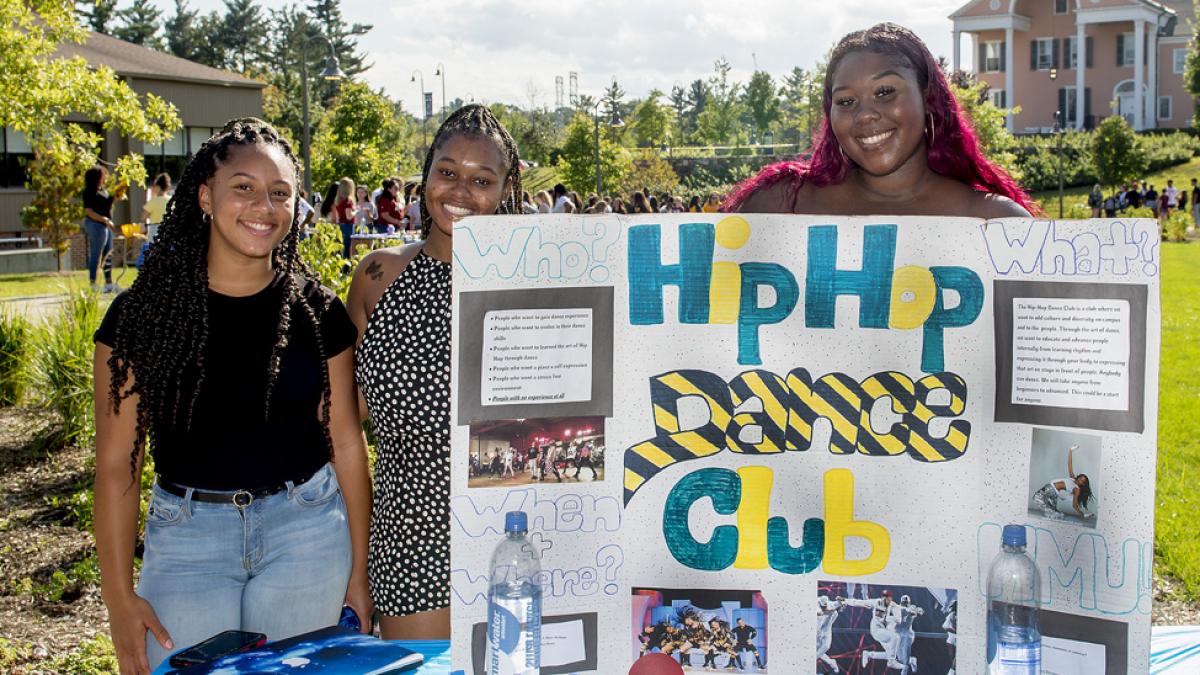 Students holding up a banner of the Pace HipHop Club.