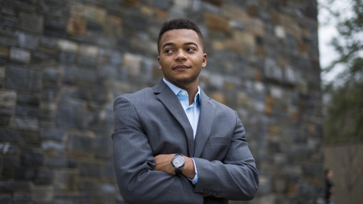 Student dressed in business attire.