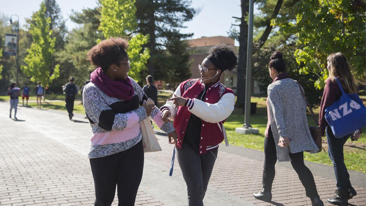 Two students walking around the Westchester campus.