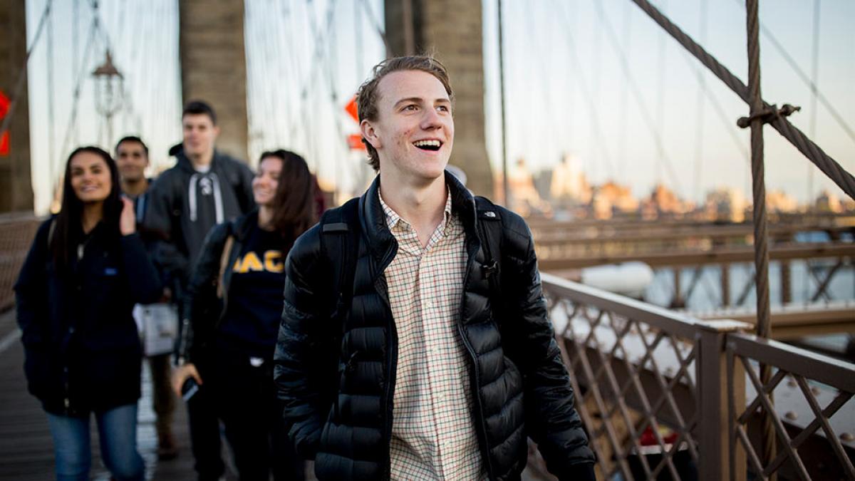 Students walking on the Brooklyn Bridge.