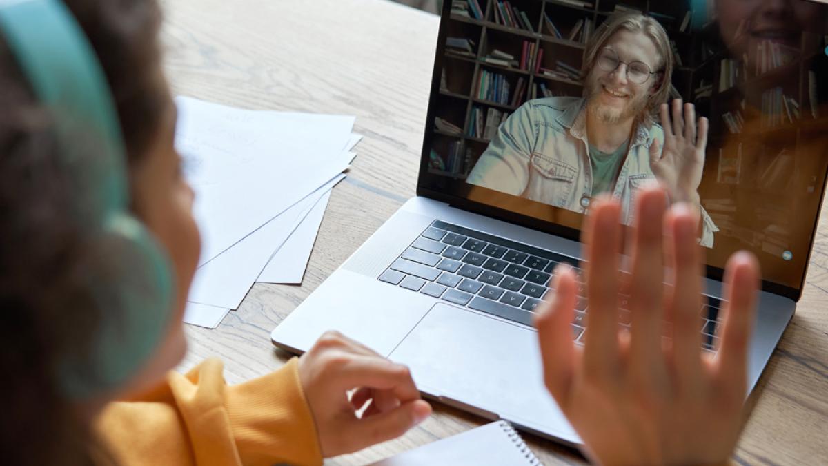 Student having online meeting with a tutor.