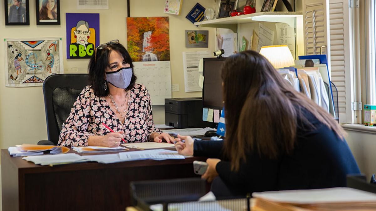 Pace advisor in her office with a student.