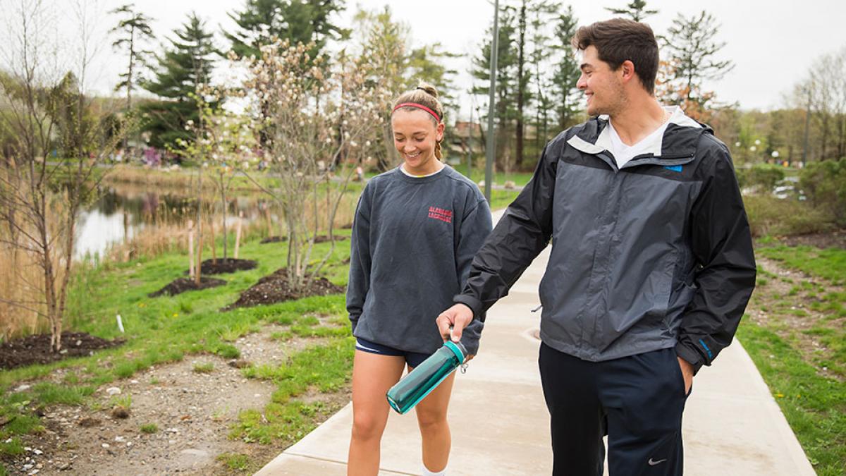 Two students walking around the Westchester campus.