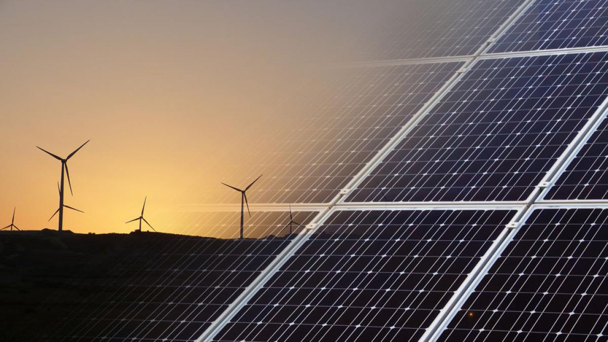 windmills and solar energy panels representing sustainable businesses