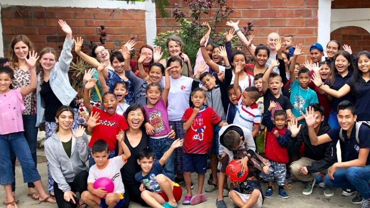 Ecuadorian Children and Adults Waving