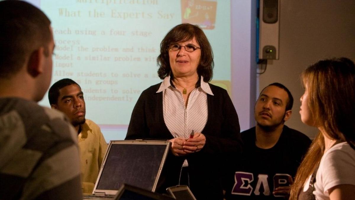 College Professor Speaking with diverse students