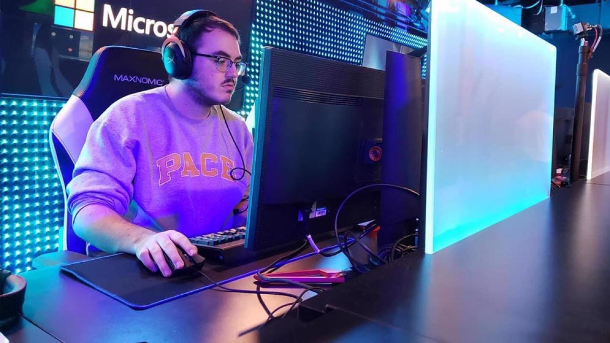 young man in a pace sweatshirt at a computer