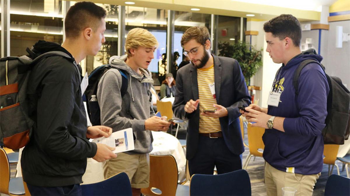 four students networking at the Pace University Entrepreneurship Lab