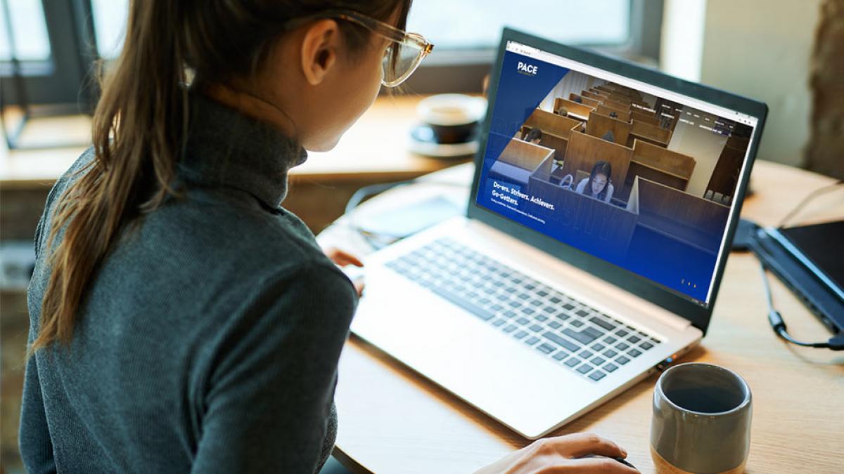 young woman looking at a laptop