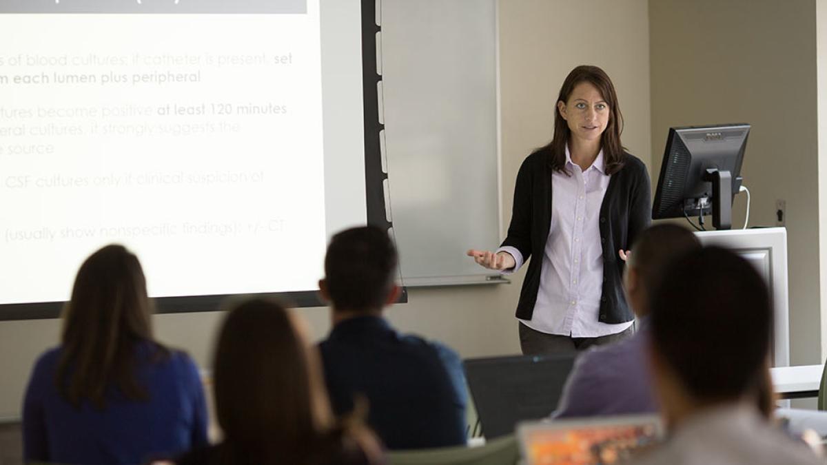 PA faculty member teaching a class of students.