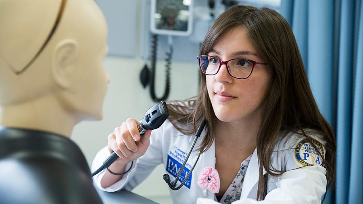 CHP student working with a manikin.