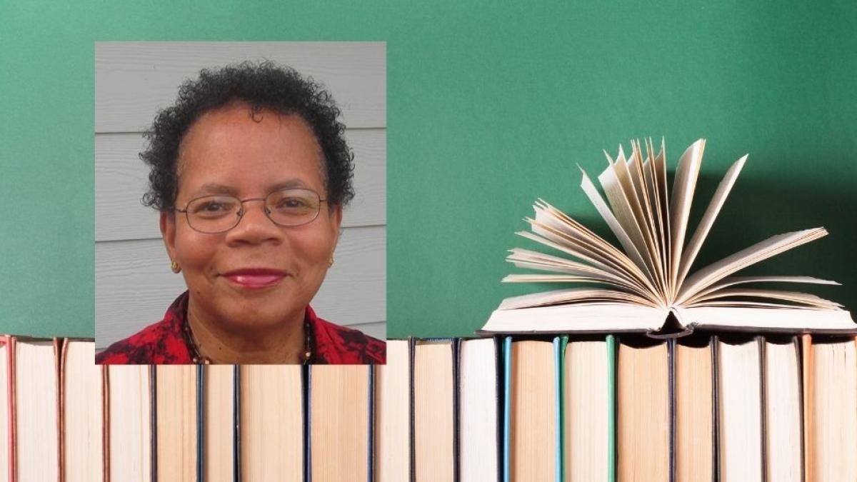 elderly woman with glasses and books
