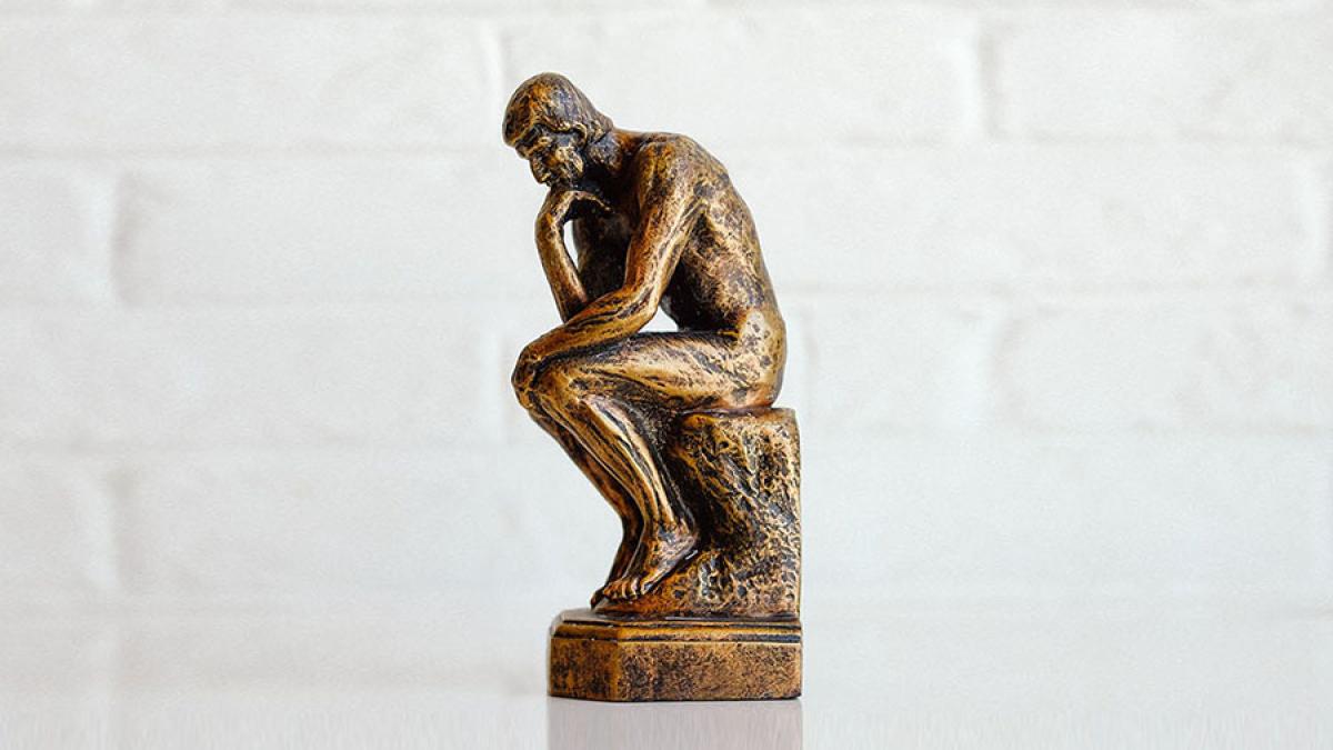 Bronze thinking man statue