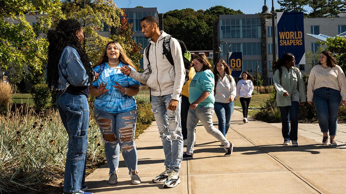 Group of students walking around the Westchester campus.