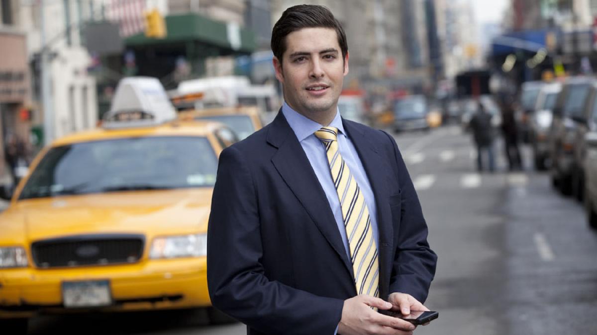 Lubin alumnus standing in Lower Manhattan near One Pace Plaza