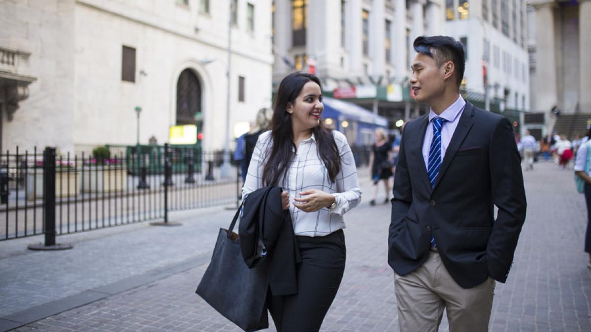 two Lubin graduate students walking in Lower Manhattan near Pace University's New York City Campus