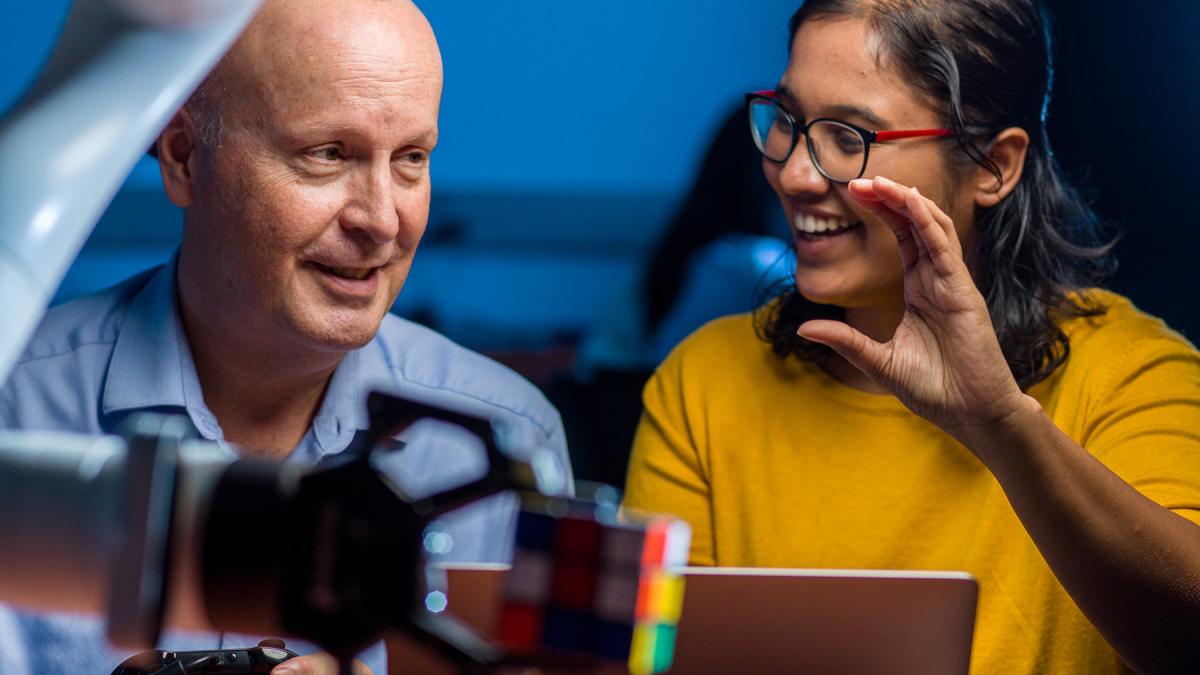 Seidenberg faculty member working with a student on a  project.