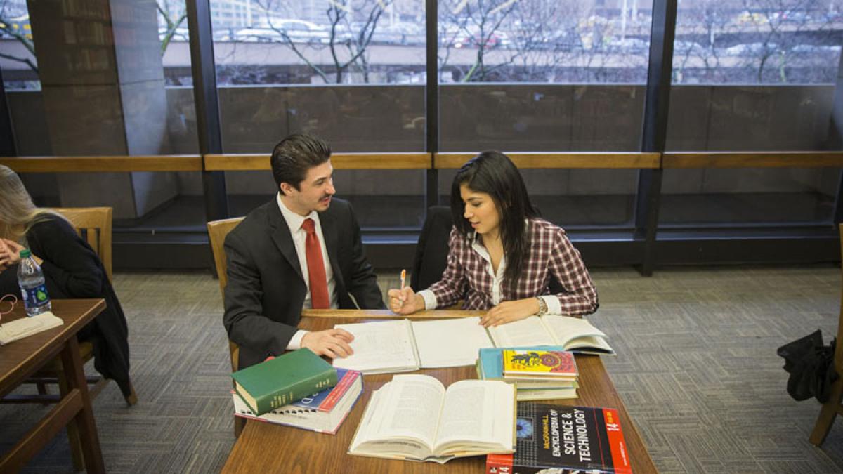 two Lubin students studying in the Student Center of One Pace Plaza on the New York City Campus