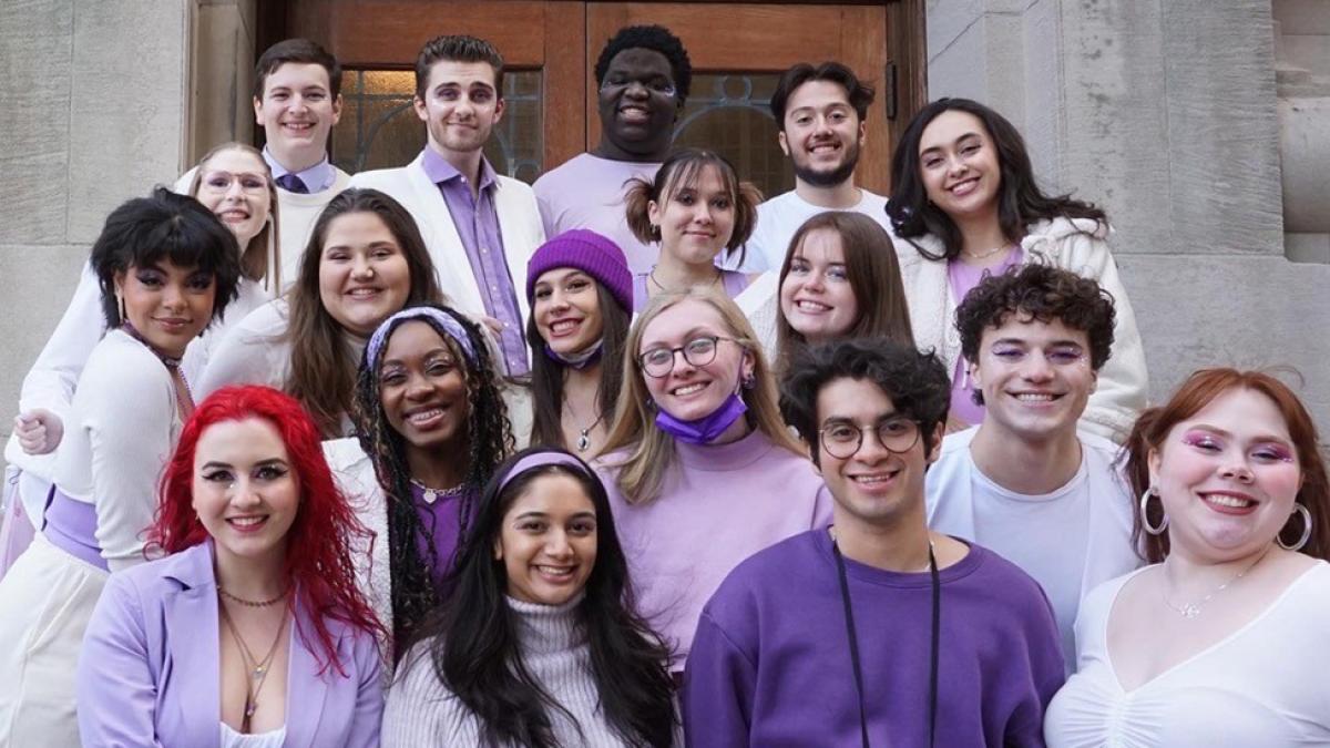 Pace's A Capella Group Frequency stands smiling at the camera