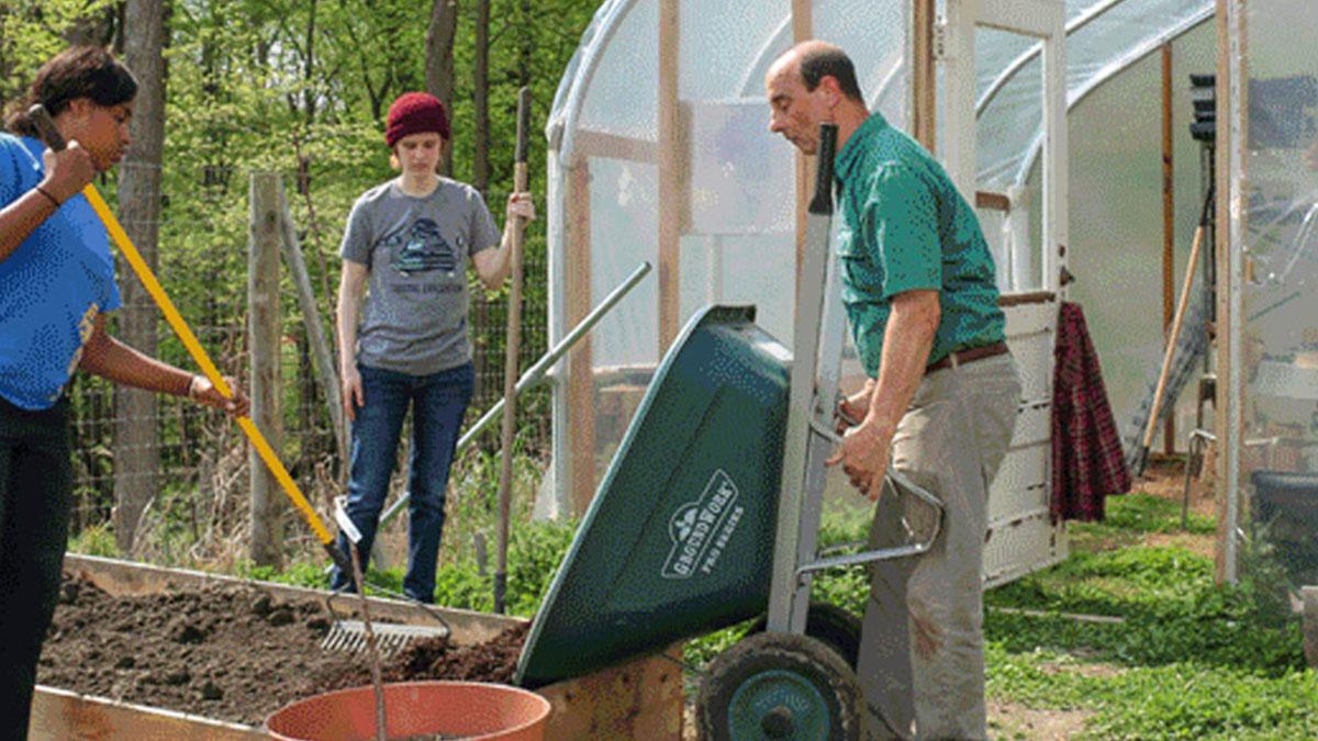 Students tending to the garden in Plesantville