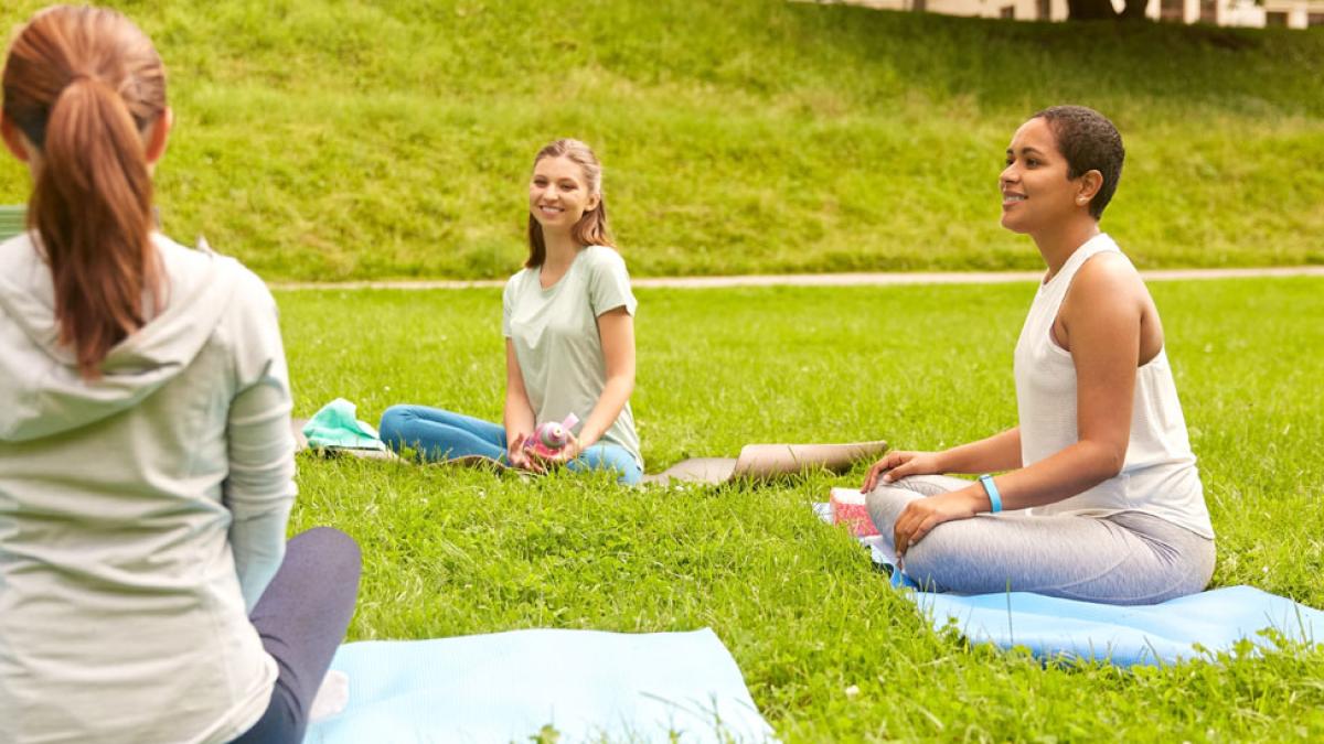 women doing yoga outdoors