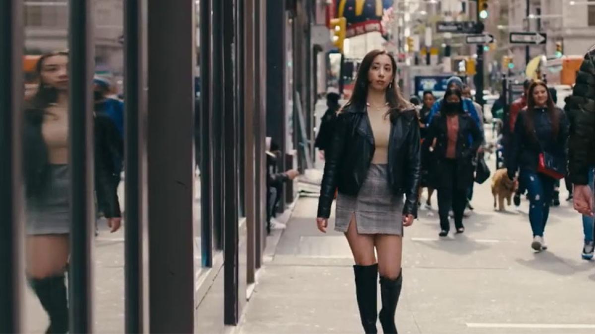 woman walking down an NYC street