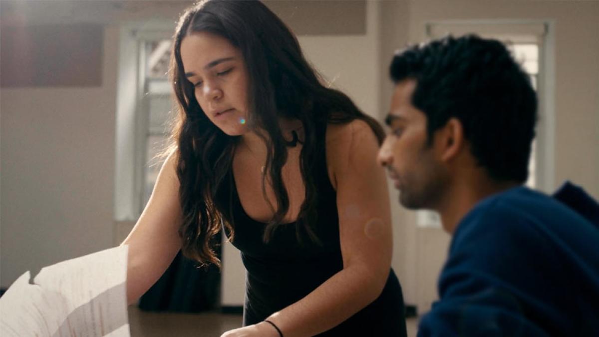 woman and man reviewing a script