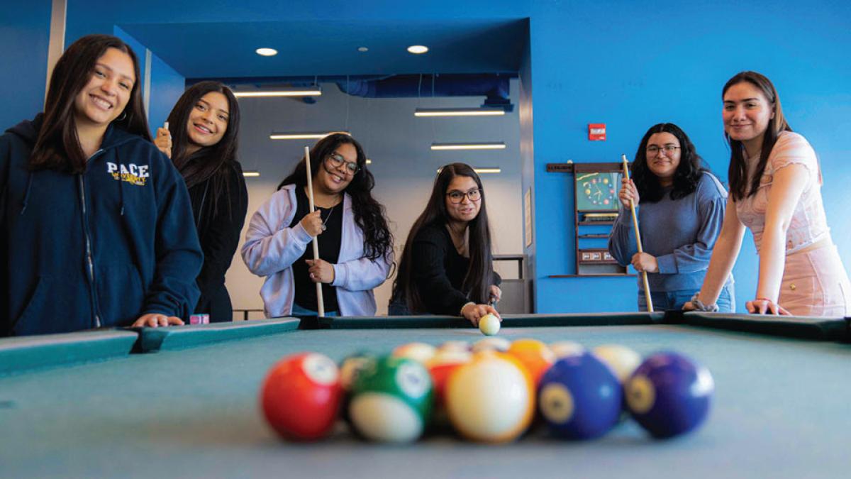 group of women shooting pool