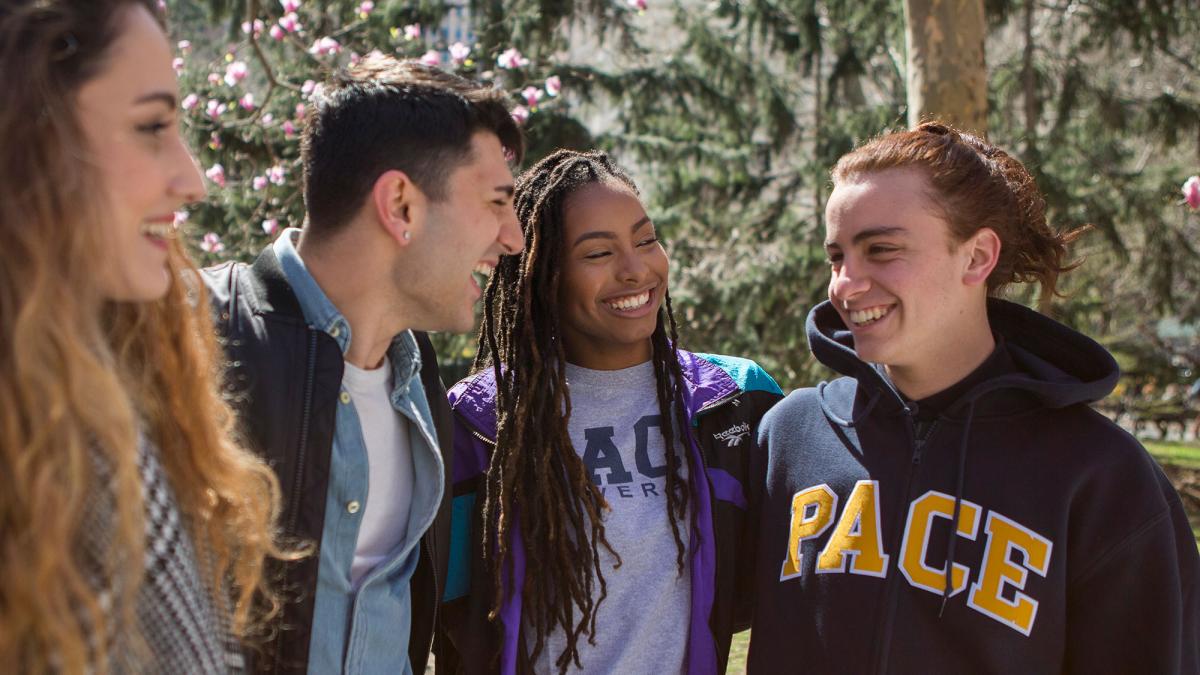 Group of Pace University students talking and laughing.