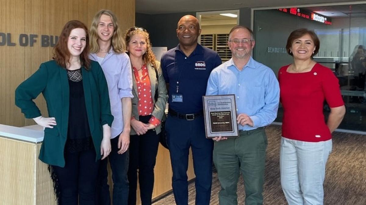 Staff of Pace's Small Business Development Center holding the 2022 Excellence & Innovation Award