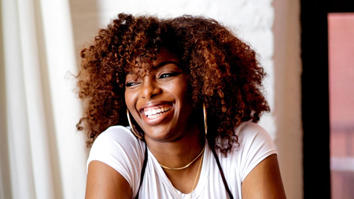 woman smiling looking away from camera