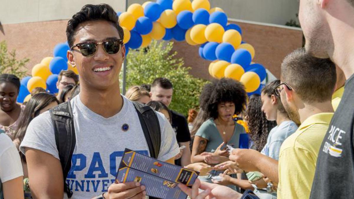 Student participating at a club fair.