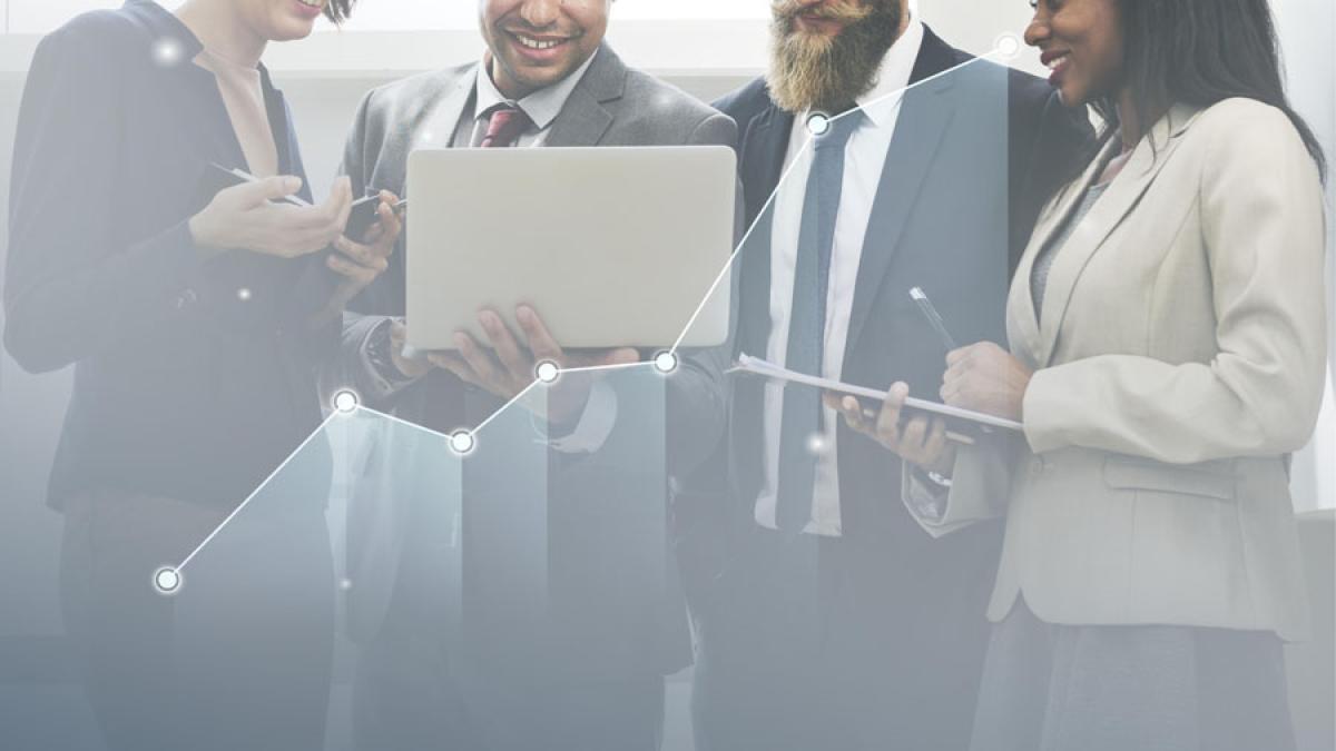 business people conferring with laptops representing the idea of "milestones"