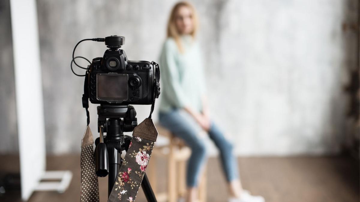 camera and woman at photoshoot