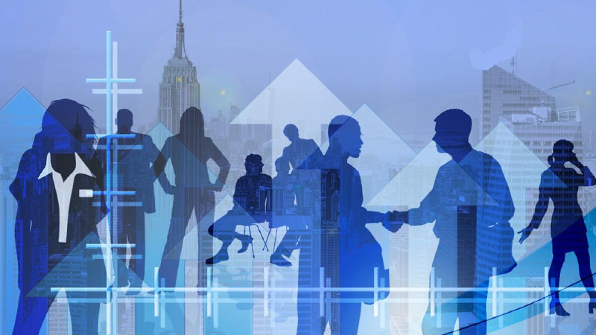 business people silhouettes against New York City skyline