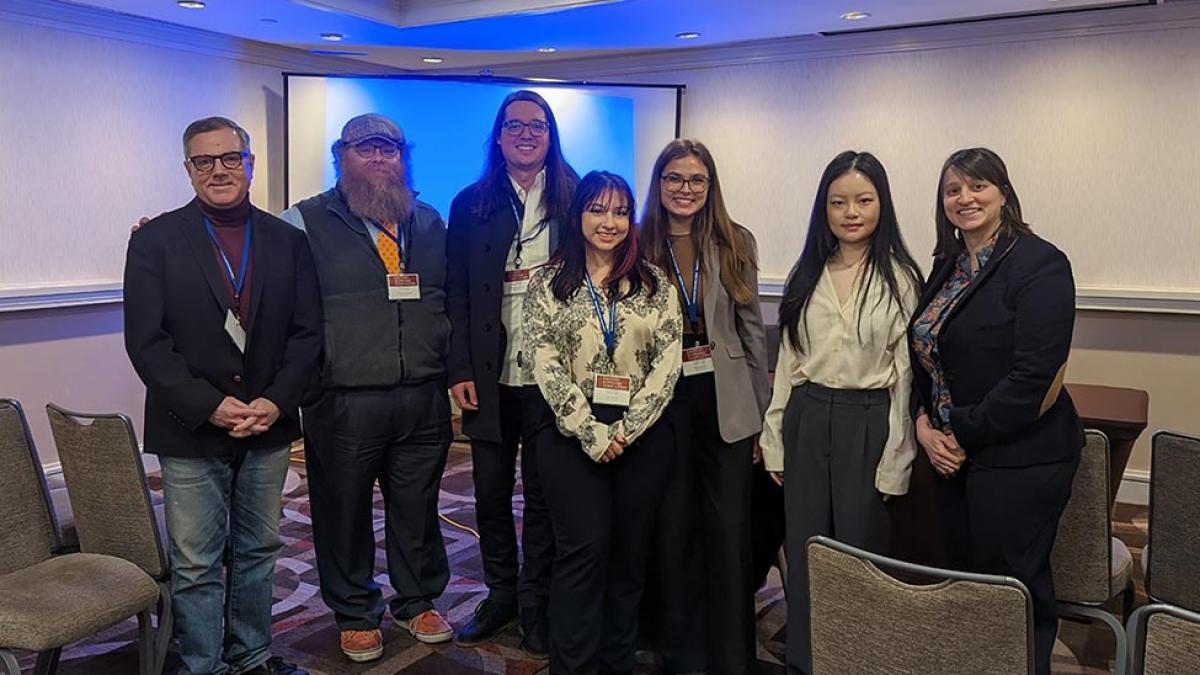 Dyson Professor Mary Kaltenberg, student Hanyu Li and Economics faculty and students at a conference