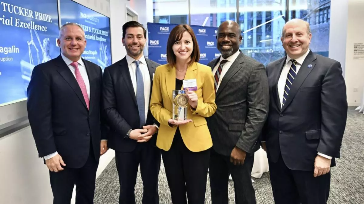 Five individuals holding the 2023 Tucker Prize
