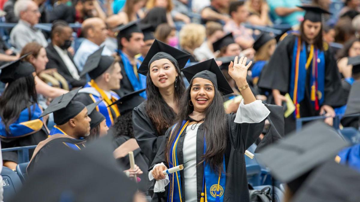 group of pace university graduates at commencement
