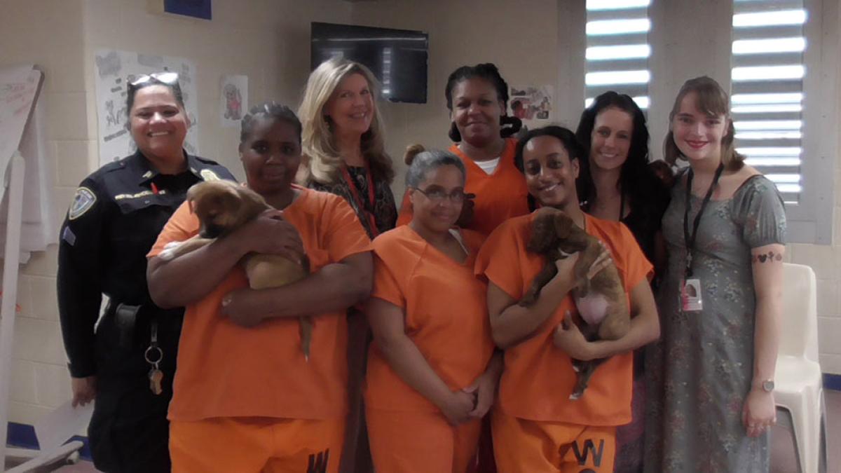 incarcerated women with puppies