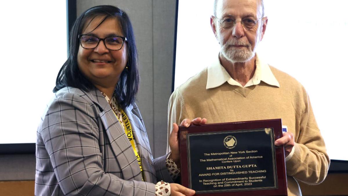 Shamita Dutta Gupta accepting the Mathematical Association of America (MAA) Distinguished Teaching Award