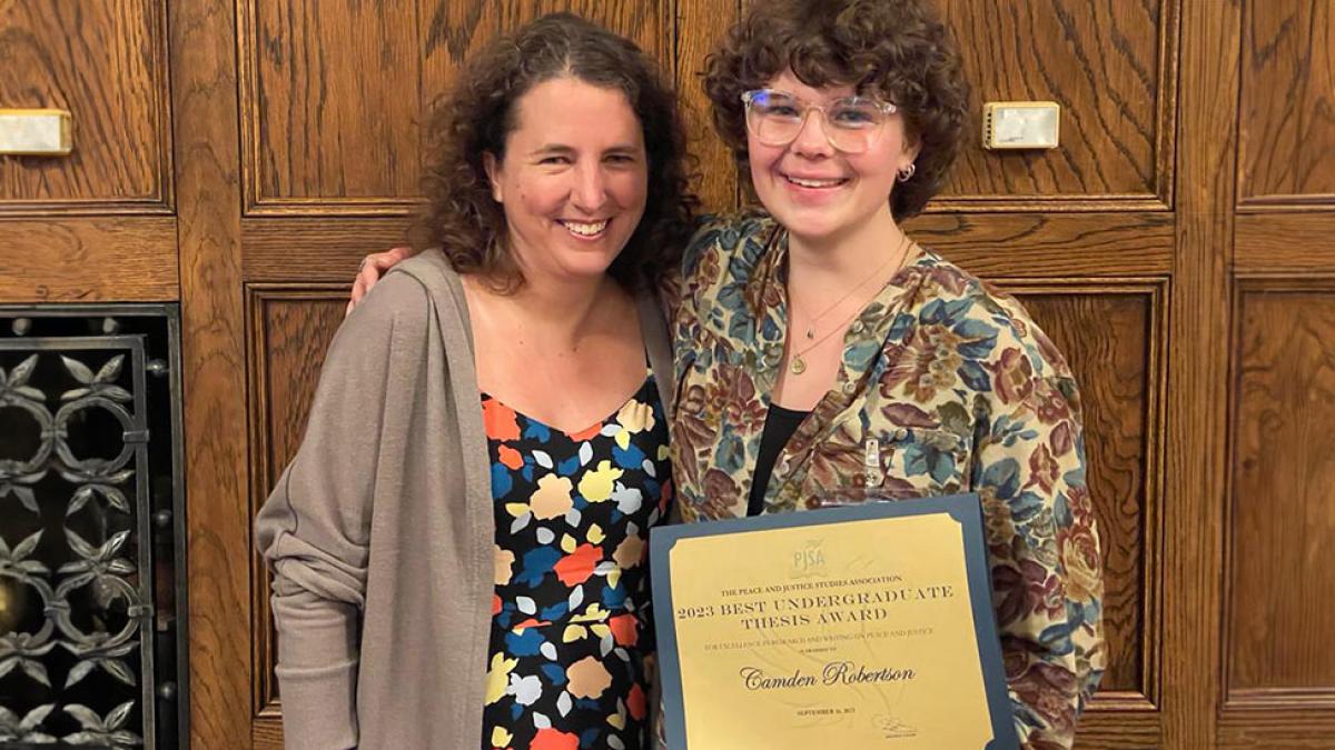 Pace University's Peace and Justice Studies student Camden Robertson with her award