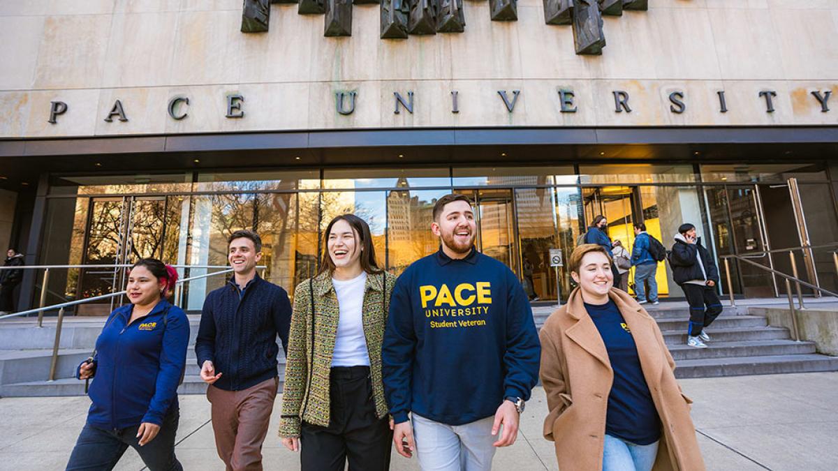 Pace University students walking out of the One Pace Plaza entrance.