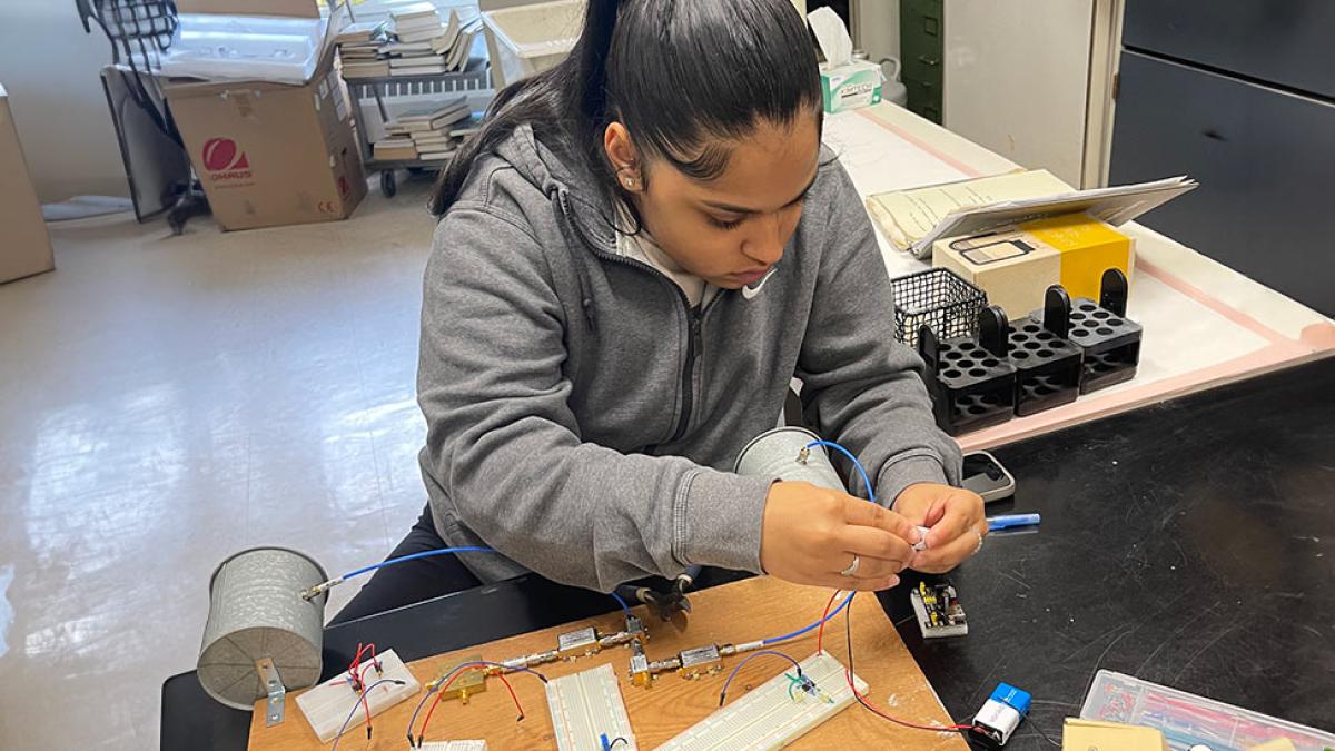 One of Pace University's Mathematics professor Analee Miranda's students working with circuits