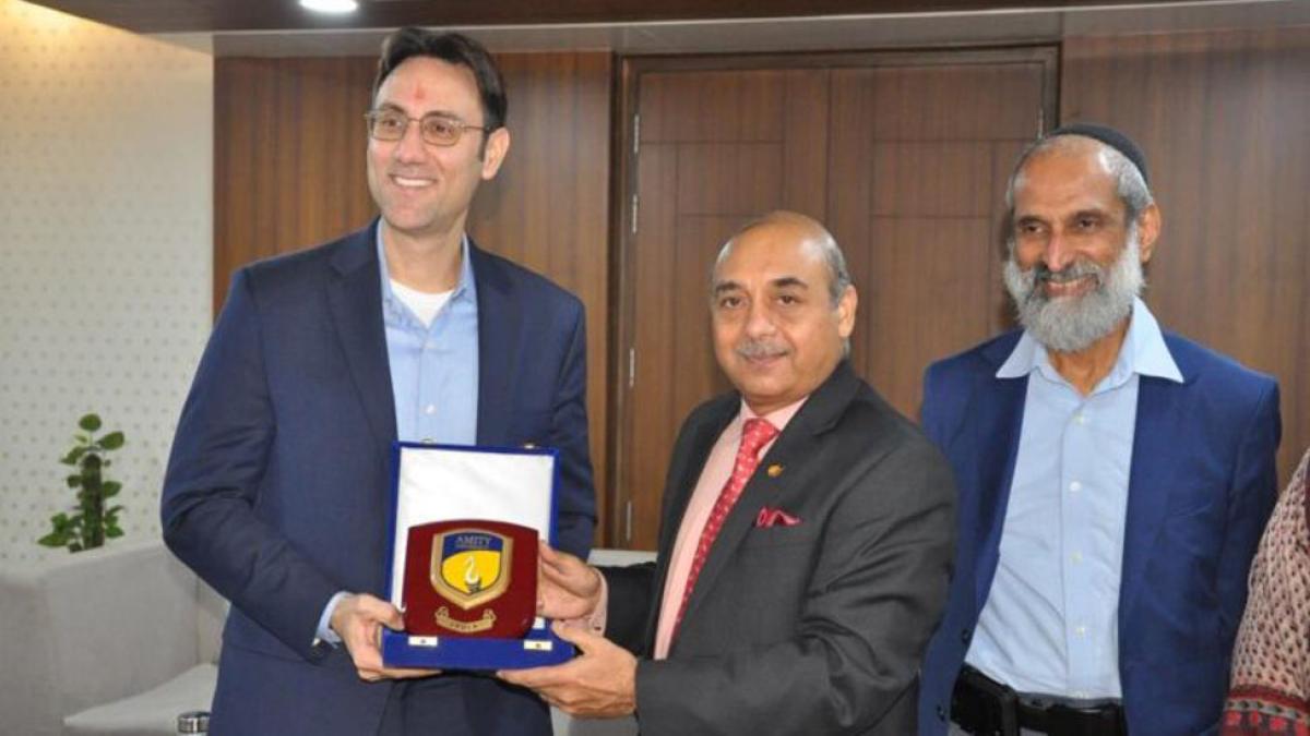 Lubin's Dean Meletiadis and Professor Viswanath with a representative from Amity University in India