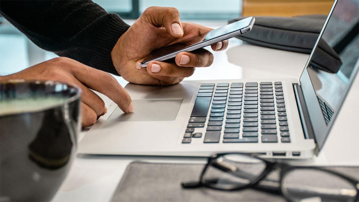 woman holding phone and typing