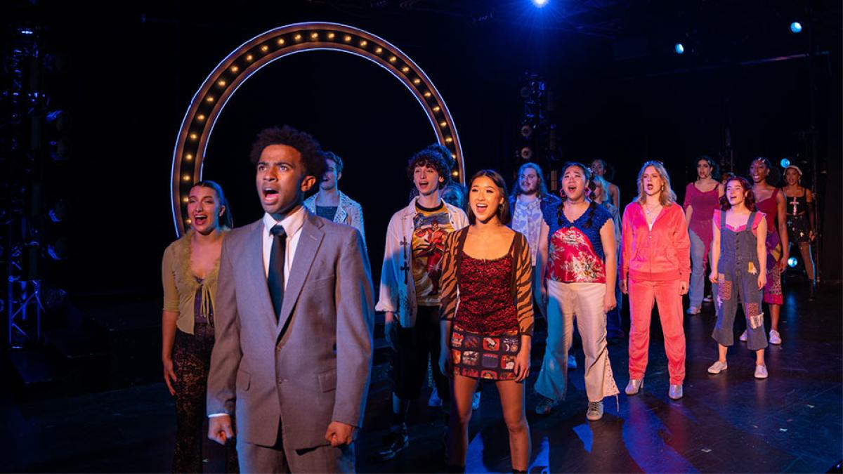 ensemble cast performing on stage at Pace University